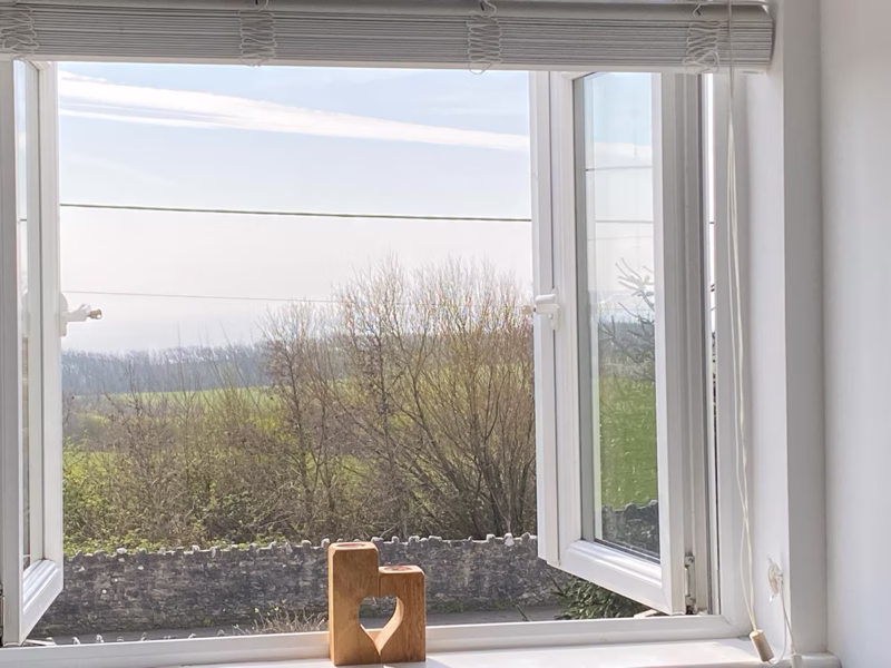 Sea Dream Lodge — sea view framed by the bedroom window